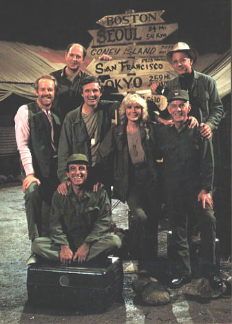 Cast photo infront of sign post